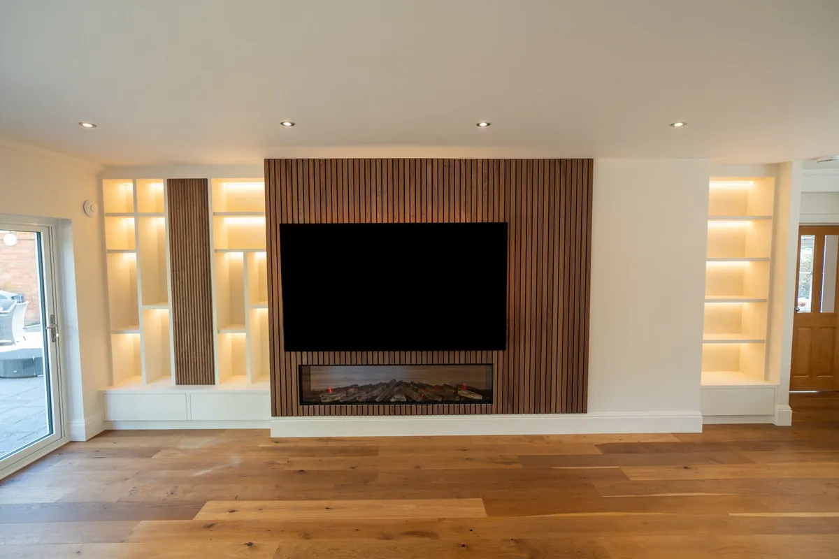 Walnut slat media wall with linear fire, Leighton Buzzard